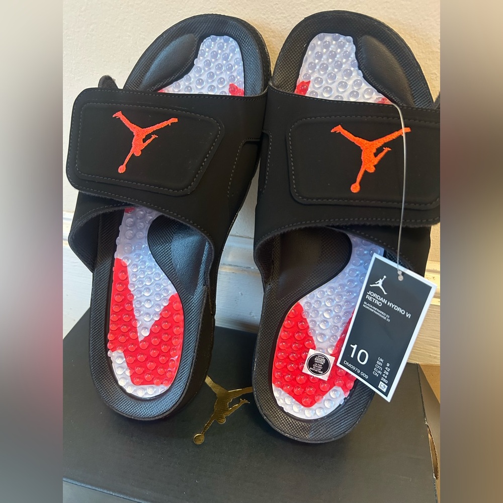 Jordan Hydro VI Retro Slide sandals in the Black/Infrared 23 colorway